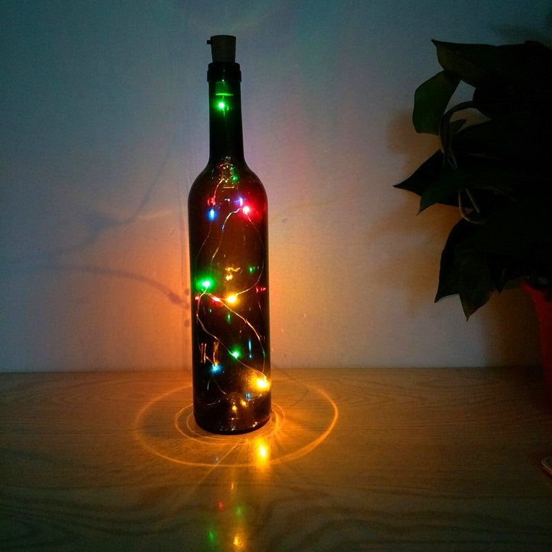 Botella de vidrio decorativa luminosa con luces LED.