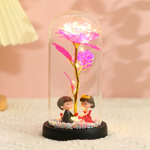 Caja de regalo con cubierta de vidrio y flor de pan de oro