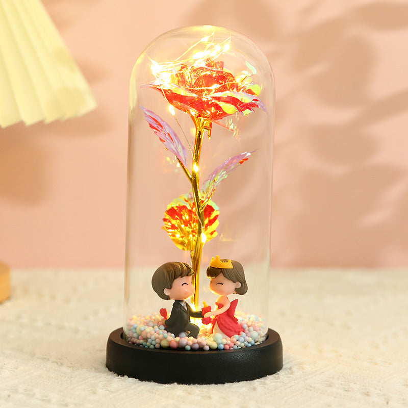 Caja de regalo con cubierta de vidrio y flor de pan de oro