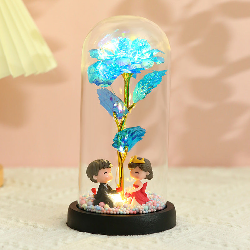 Caja de regalo con cubierta de vidrio y flor de pan de oro