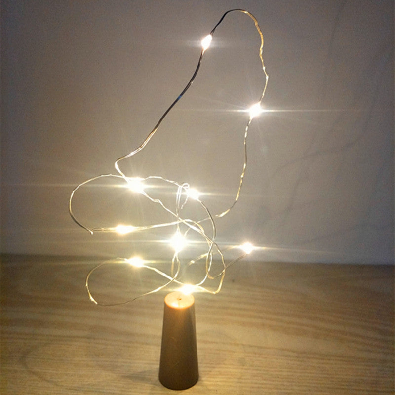 Botella de vidrio decorativa luminosa con luces LED.