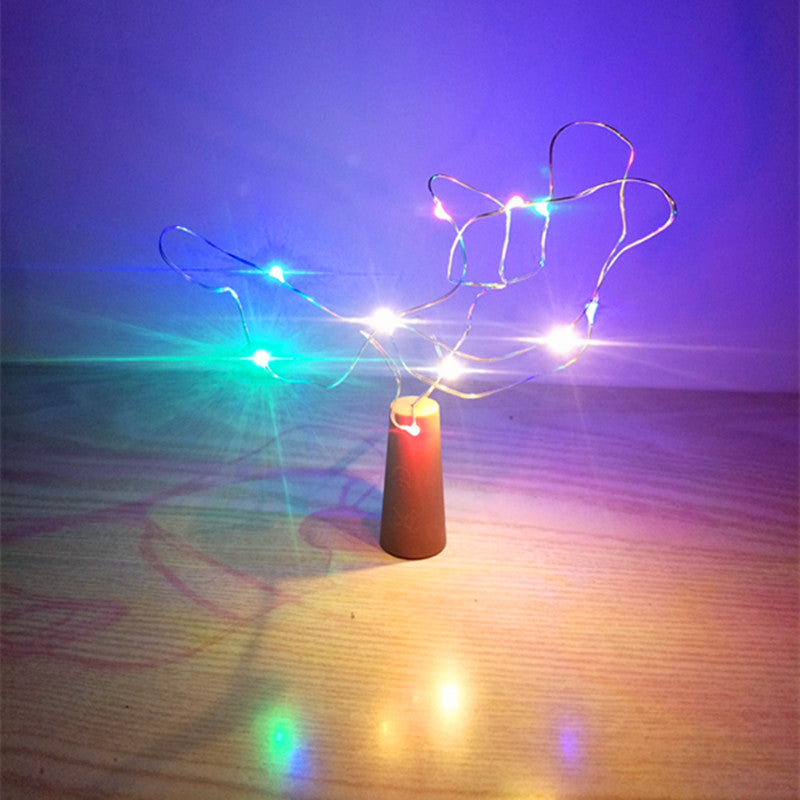 Botella de vidrio decorativa luminosa con luces LED.