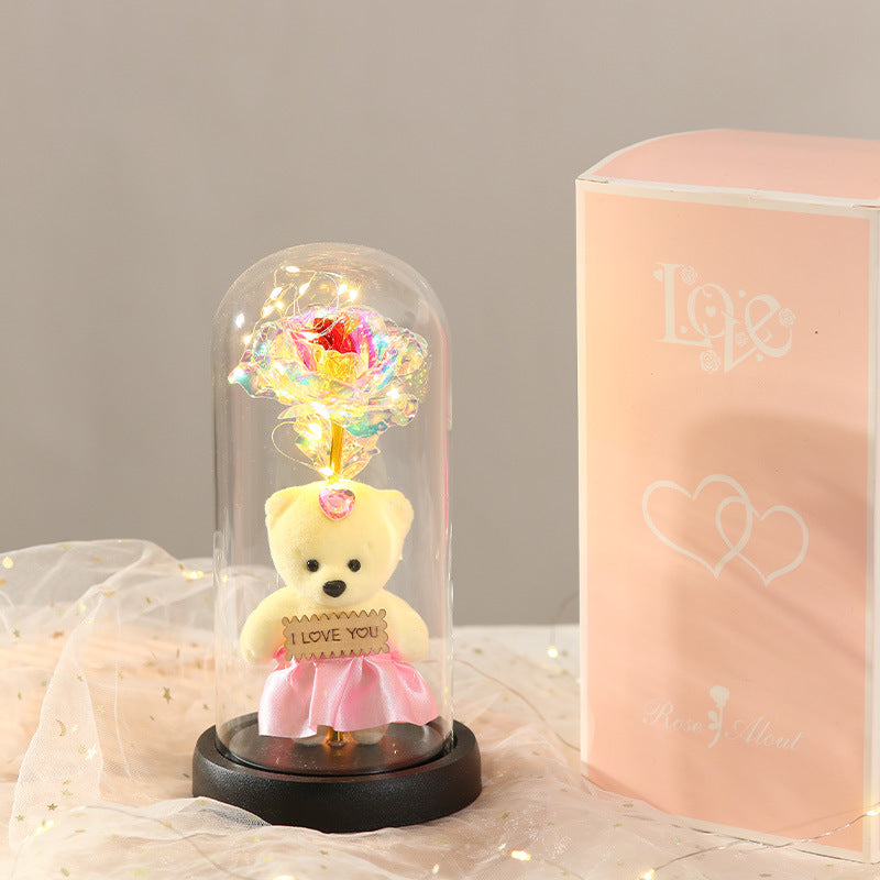 Caja de regalo con cubierta de vidrio y flor de pan de oro