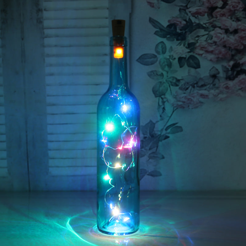 Botella de vidrio decorativa luminosa con luces LED.