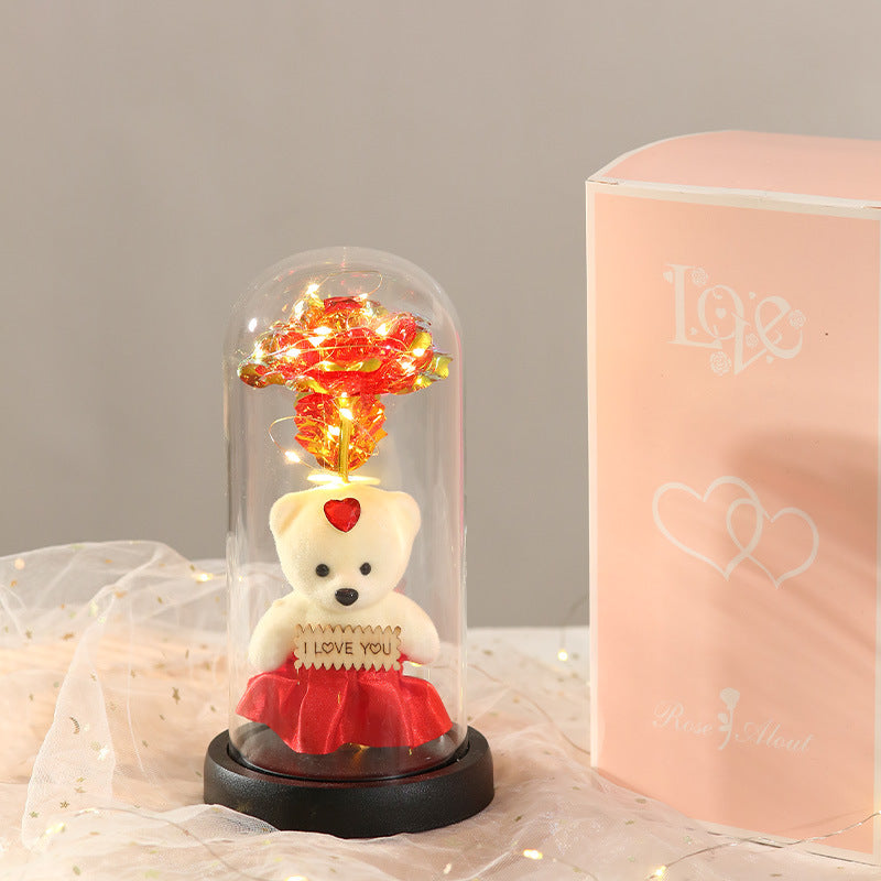 Caja de regalo con cubierta de vidrio y flor de pan de oro